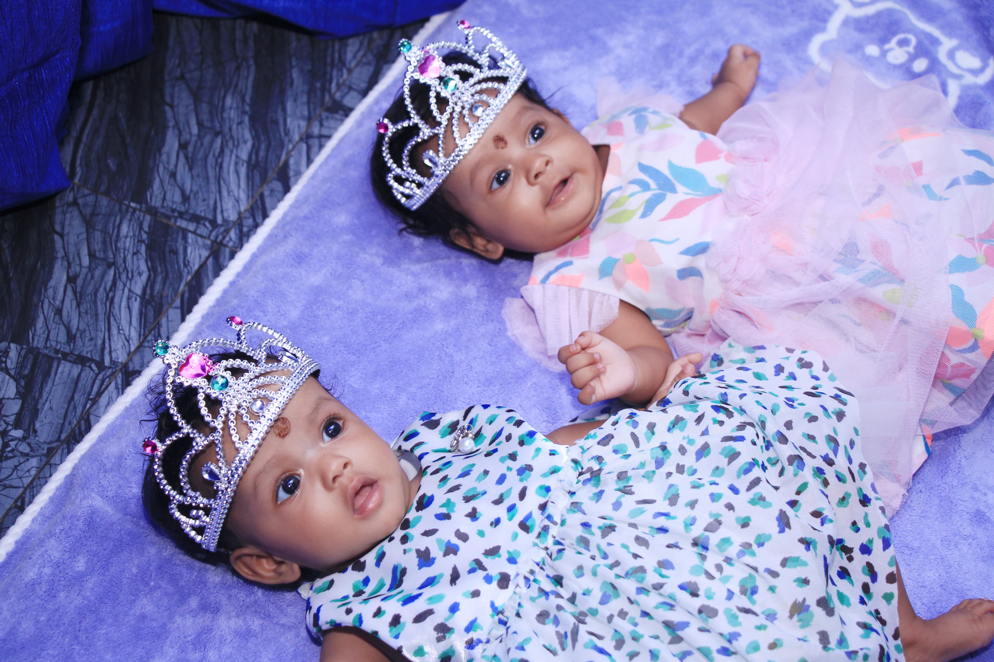 Newborn baby with a soft backdrop during a photoshoot